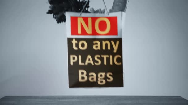 Placer un sac en papier avec slogan plus de sacs en plastique sur une table. Concepts environnementaux — Video