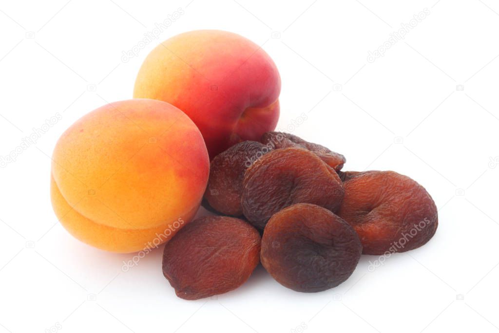 close-up shot of fresh and dried apricots isolated on white