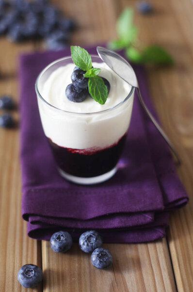 Blueberry Yogurt On A Wooden Background