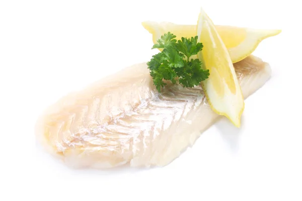 Stück Roher Fisch Mit Petersilie Und Zitrone Stockfoto