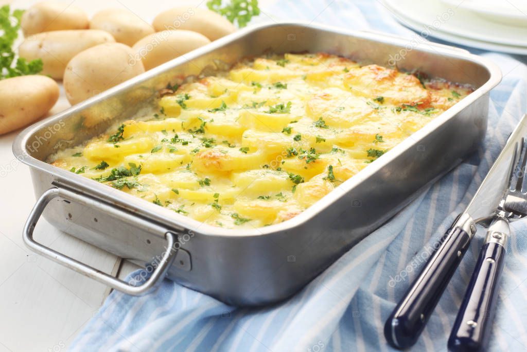 baked potato with cheese in baking tray