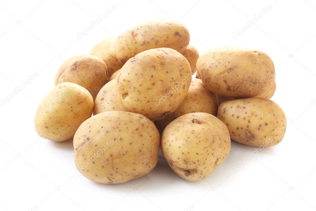 close-up shot of raw potatoes on white background