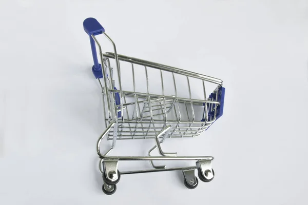 Shopping Concept Empty Shopping Cart Wheels White Background — Stockfoto