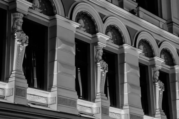 Ladies sculptures on the wall in monochrome colours. Stock Image