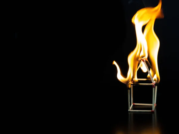 Burning match house with black background, fire house model prop — Stock Photo, Image