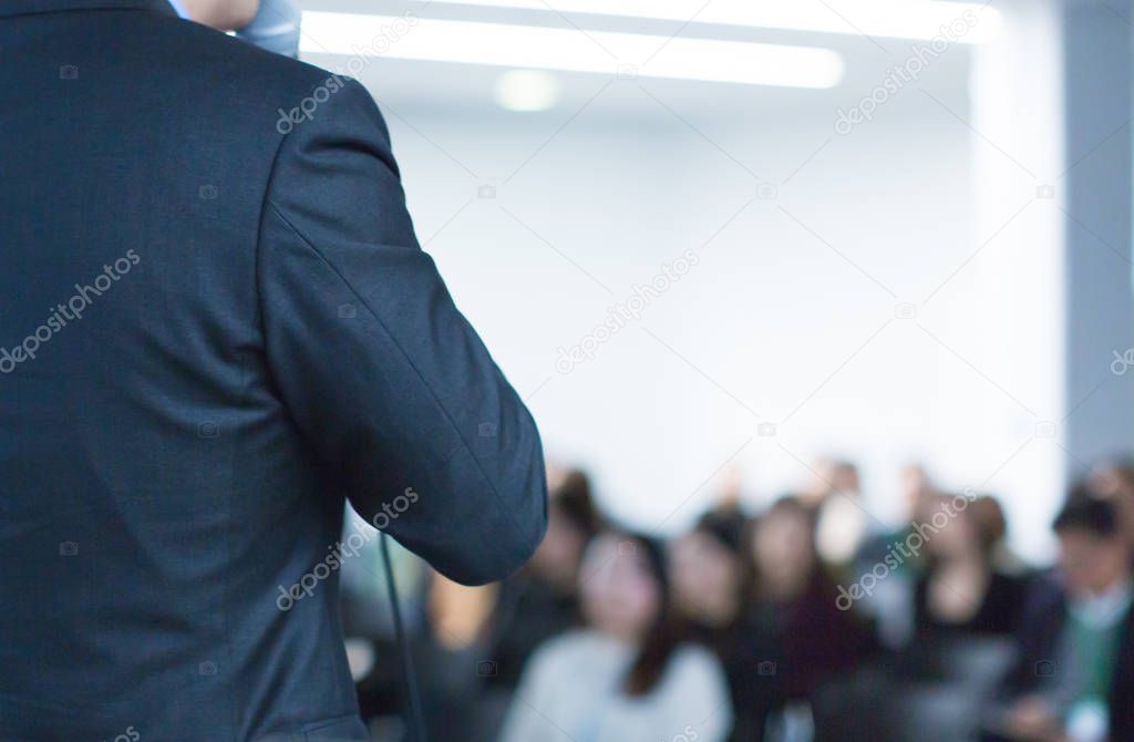 Meeting concept. Conference blur with business people training and learning. Coaching concept with blurred background. Speaker talking to audience in hall during seminar event. Lecture series speech.