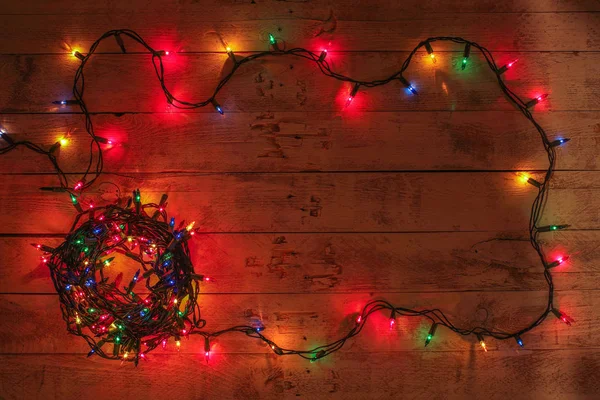 Christmas background with colorful lights and free text space. Christmas lights frame. Garland.