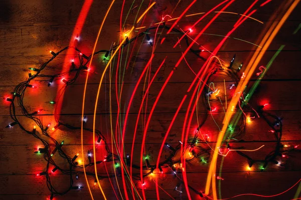 Colorful Christmas garland warm lights. Multicolored light lines. — Stock Photo, Image