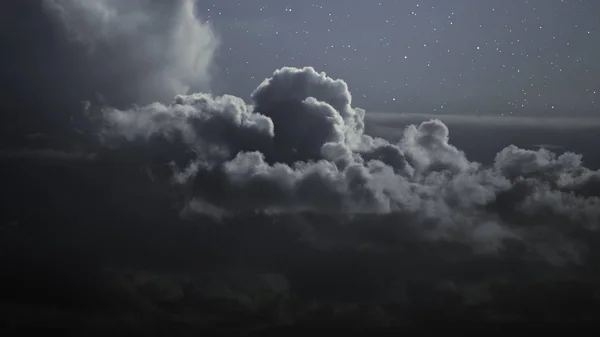 Cloudy night with stars — Stock Photo, Image