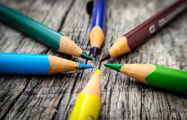 Wood color Pencils on Wood Table Background.