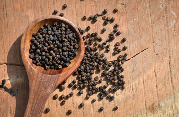 Black Peppercorns Wooden Spoon Wooden Background — 스톡 사진
