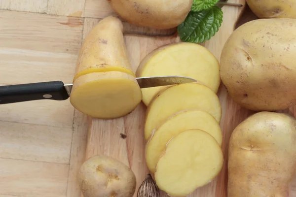 stock image Potatoes raw vegetables with slices for cooking