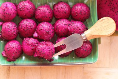 Fresh dragon fruit organic with scoop spheres clipart