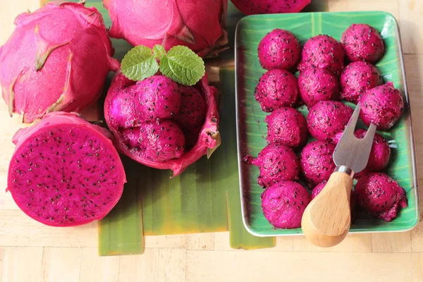 Fresh dragon fruit organic with scoop spheres — Stock Photo, Image