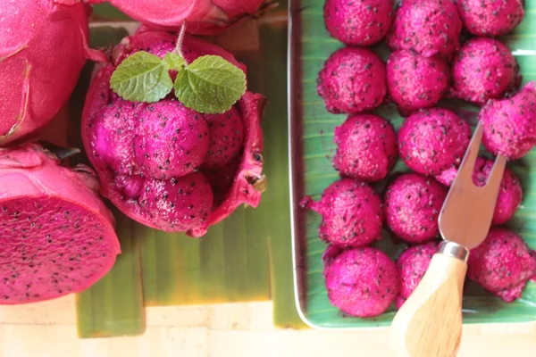 Fresh dragon fruit organic with scoop spheres — Stock Photo, Image