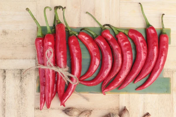 Fresh red hot chilli on wood background — Stock Photo, Image