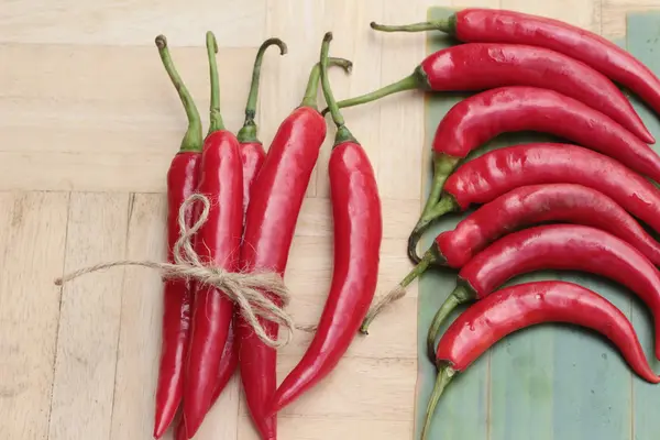 Fresh red hot chilli on wood background — Stock Photo, Image