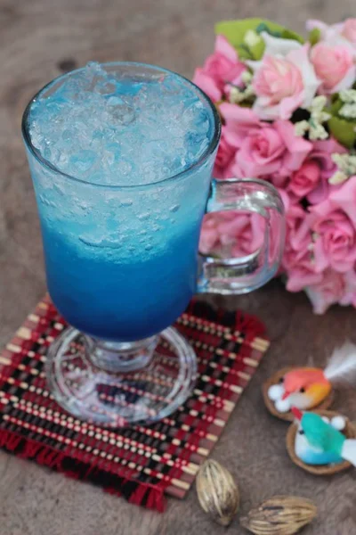 Blue lemon soda drinking on wood background. — Stock Photo, Image