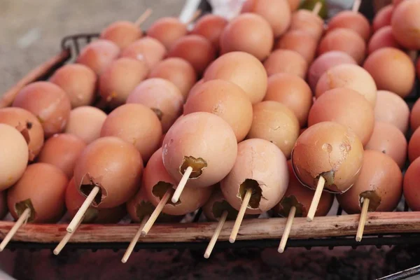 Egg grilled on the sticks at stove. — Stock Photo, Image