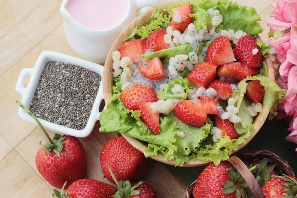 Strawberry salad ingredients, lettuce, chia seeds, barley
