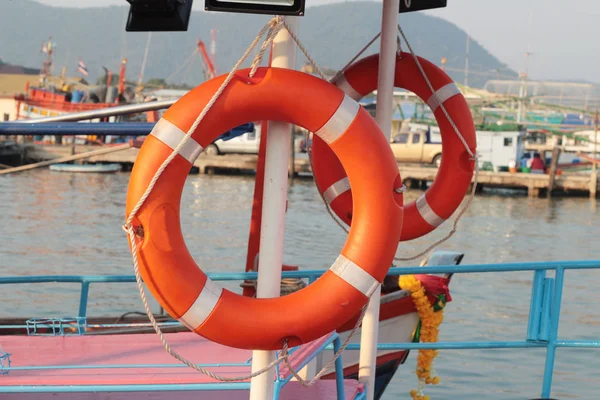 Ring buoy on the boat with the ocean — Stock Photo, Image