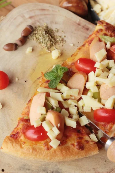 Italian pizza is delicious on wood background — Stock Photo, Image