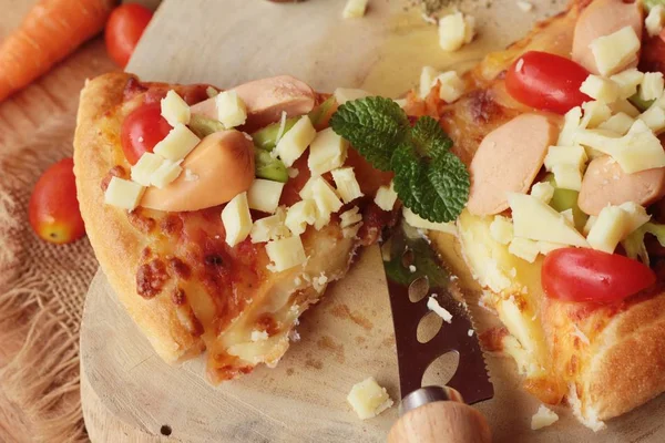 Italian pizza is delicious on wood background — Stock Photo, Image