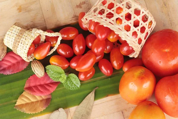 Fresh red tomatoes organic on wood background — Stock Photo, Image