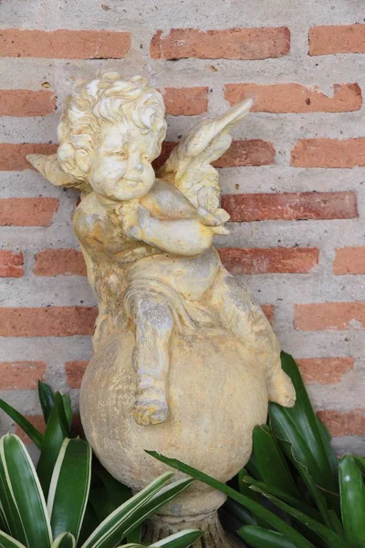 Cupid statue is beauty in the garden