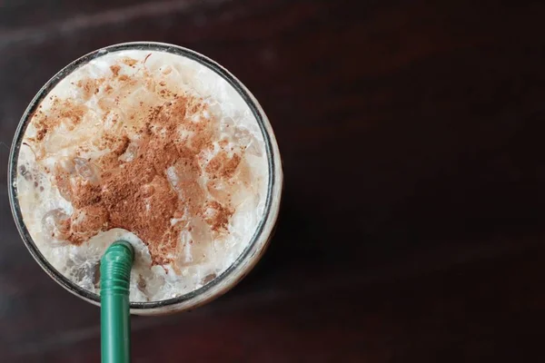 Iced chocolate with milk on wood background — Stock Photo, Image