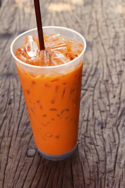 Iced milk tea delicious on wood background — Stock Photo, Image