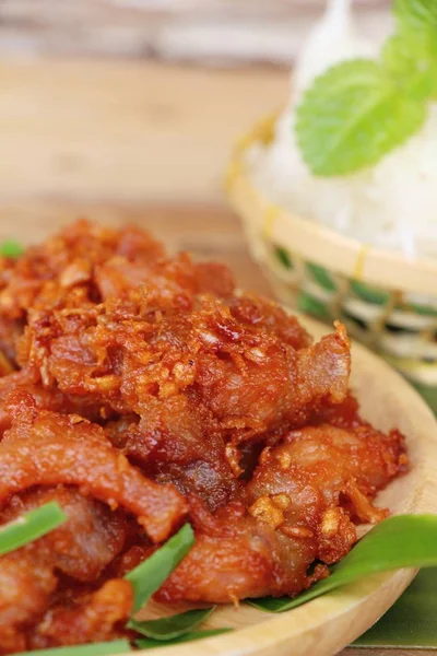 Fried pork with garlic and sticky rice — Stock Photo, Image