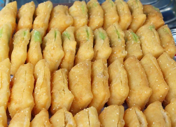 Deep fried dough put thai pandan custard — Stock Photo, Image