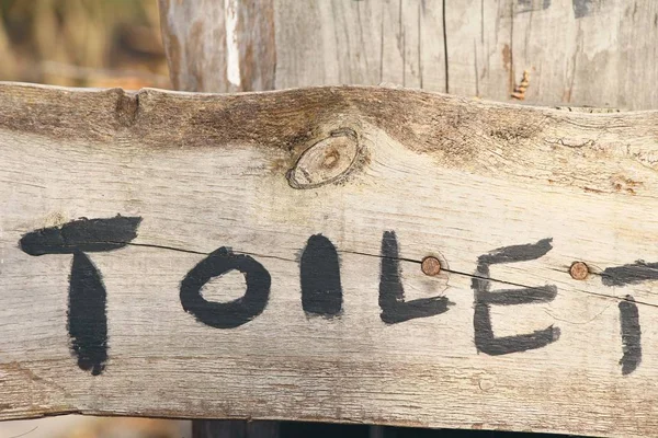 Symboliser flèche pointant aller aux toilettes façon — Photo