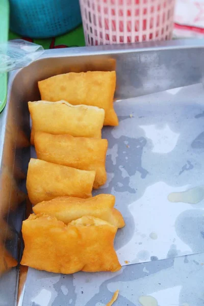 Deep fried dough put sweet condensed milk — Stock Photo, Image