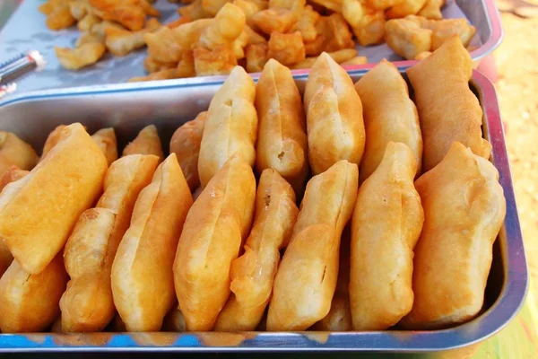 Deep fried dough put sweet condensed milk — Stock Photo, Image