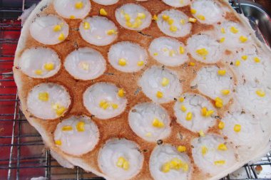 Hindistan cevizi sütü karıştırın şeker ve un, Tay tatlı