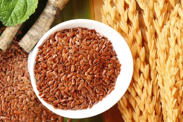 Flax seeds for health on wood background — Stock Photo, Image