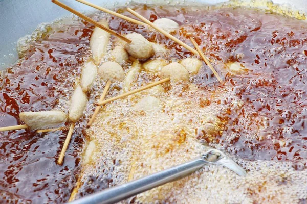 Fried meatballs and sausage at street food — Stock Photo, Image