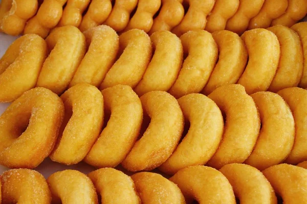 Donuts and baked bread combine at street food — Stock Photo, Image