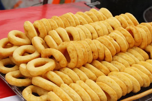 Donuts and baked bread combine at street food — Stock Photo, Image