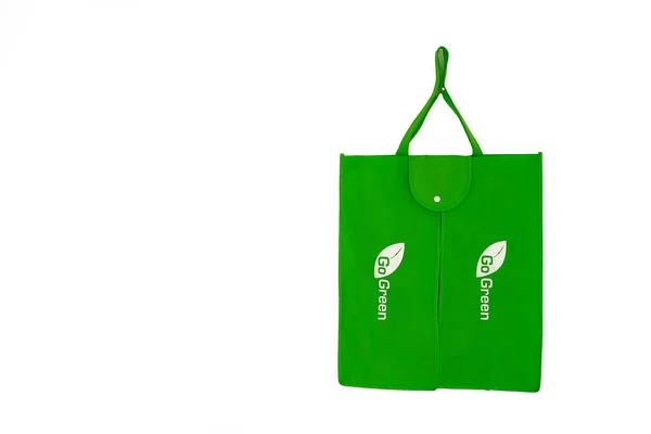 a eco fabric cloth bag with eco green logo isolated on white background. alternative plastic with eco bag.