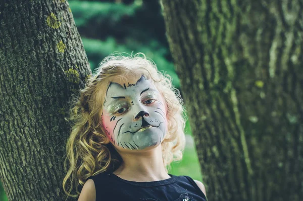 Girl with kitty face-painting — Stock Photo, Image