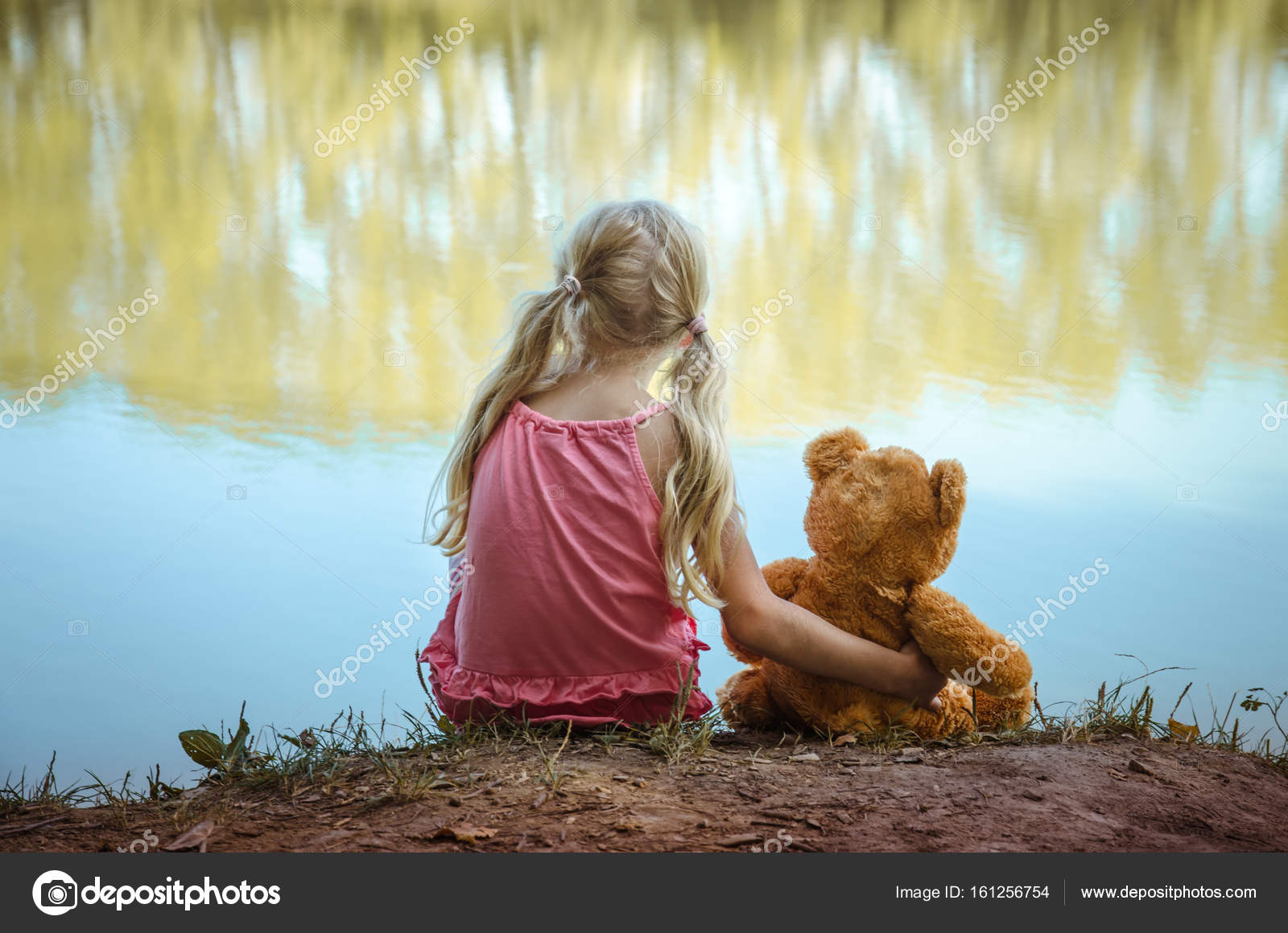 child and teddy bear