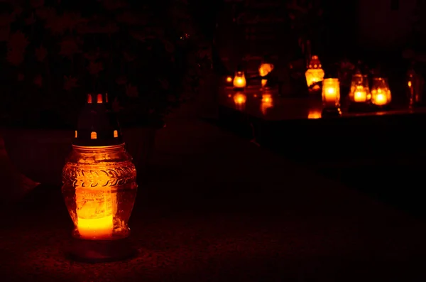 Burning candle in lantern at night — Stock Photo, Image