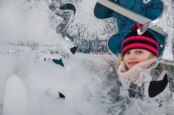 Little child with ice sculptures — Stock Photo, Image