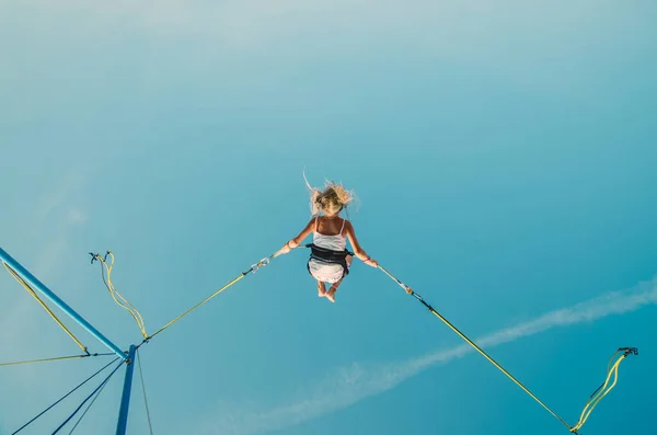 Cute Teen Girl Enjoying Bungee Jumping Attraction While Swinging Blue — Stock Photo, Image