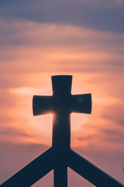 views to the christian cross in colorful sunset