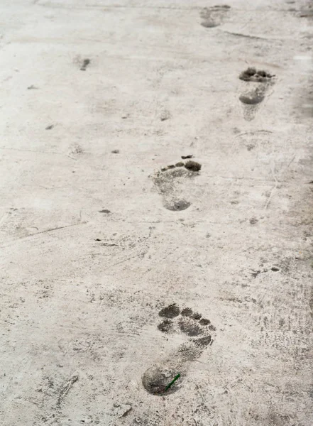 bare foot imprints on old stoneed texture floor