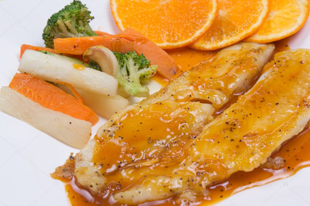 Dory fish steak with orange sauce — Stock Photo © kung_mangkorn 127284000